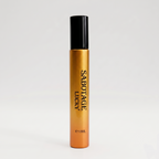 Sabotage Lucky 10ml travel spray bottle with metallic gold body and black cap against a light gray background