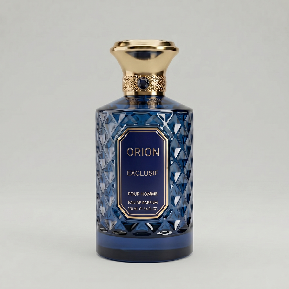 Sabotage Orion Exclusif 100ml Eau de Parfum in a deep blue faceted diamond-cut glass bottle with flared gold cap and blue label