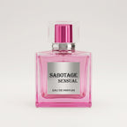 Front view of Sabotage Sensual 100ml Eau de Parfum in a square pink glass bottle with silver label and clear square cap against a light gray backgroun