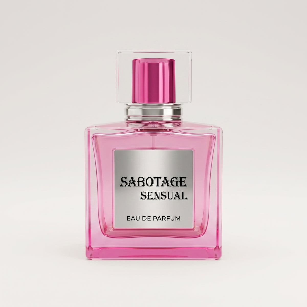 Front view of Sabotage Sensual 100ml Eau de Parfum in a square pink glass bottle with silver label and clear square cap against a light gray backgroun
